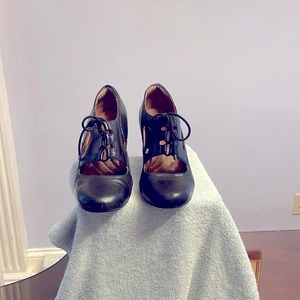 Black 9 1/2 leather cut out/lace up booties by Clark’s